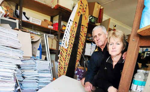 Sawtell Newsagency owners Sharon and Bryan Shadbolt survey the broken back door where entry was gained to the premises. Sawtell Newsagency owners Sharon and Bryan Shadbolt survey the broken back door where entry was gained to the premises.